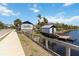Charming community boathouses along the water with boardwalk, and a scenic path by the water at 230 Sapphire Lake Dr # 201, Bradenton, FL 34209