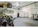 Spacious garage with ample storage, including shelves and cabinets for organization at 230 Sapphire Lake Dr # 201, Bradenton, FL 34209
