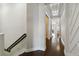 Bright hallway with wood flooring, white walls, and decorative trim at 230 Sapphire Lake Dr # 201, Bradenton, FL 34209