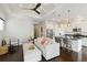Inviting living room with coffered ceilings, opening into modern kitchen with stainless steel appliances at 230 Sapphire Lake Dr # 201, Bradenton, FL 34209