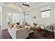 Spacious living room with vaulted ceilings, wood flooring, modern furniture, and ample natural light at 230 Sapphire Lake Dr # 201, Bradenton, FL 34209