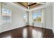 Serene main bedroom featuring tray ceiling and abundant natural light from multiple windows at 230 Sapphire Lake Dr # 201, Bradenton, FL 34209