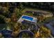 Aerial view of community pool, clubhouse, playground and lush trees at 2301 Little Country Rd, Parrish, FL 34219