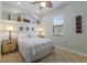Comfortable bedroom with a window view, decorative shelves, and soft lighting to create a calming space at 2301 Little Country Rd, Parrish, FL 34219