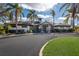 View of the single story clubhouse and entrance drive at 2301 Little Country Rd, Parrish, FL 34219