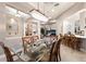 Dining room with a chandelier and a view of the living room at 2301 Little Country Rd, Parrish, FL 34219