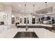 Bright kitchen featuring a kitchen island, a fireplace, and modern appliances at 2301 Little Country Rd, Parrish, FL 34219