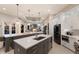 Spacious kitchen with two islands, modern appliances, and ample counter space at 2301 Little Country Rd, Parrish, FL 34219