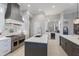 Modern kitchen features a large island, stainless steel appliances, and stylish countertops at 2301 Little Country Rd, Parrish, FL 34219