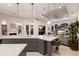 Kitchen with pendant lighting, a kitchen island, and a view of the living room at 2301 Little Country Rd, Parrish, FL 34219