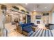 Spacious outdoor living area with fireplace, television, tile floors, and comfortable seating at 2301 Little Country Rd, Parrish, FL 34219