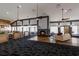 Clubhouse lounge with fireplace, seating, and natural light, perfect for relaxing and socializing at 2301 Little Country Rd, Parrish, FL 34219