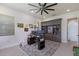 Well-lit office with built-in shelving, views of the backyard, and ample workspace with dual monitors at 2301 Little Country Rd, Parrish, FL 34219