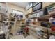 Walk-in pantry with abundant shelving for maximum storage of goods and appliances at 2301 Little Country Rd, Parrish, FL 34219