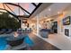 Open outdoor space featuring swimming pool, outdoor kitchen, and an area for lounging and dining at 2301 Little Country Rd, Parrish, FL 34219