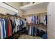 Functional closet with hanging racks, overhead storage, and organizers for shoes and accessories at 2301 Little Country Rd, Parrish, FL 34219