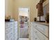 Spacious walk-in closet with custom built-ins, shelving, and ample storage space for an organized wardrobe at 2301 Little Country Rd, Parrish, FL 34219