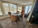 Well-lit dining area featuring a round glass table with seating for four and tile flooring at 300 N 22Nd St, Bradenton Beach, FL 34217