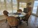 Bright dining area with large windows, a glass table, and seating for five at 300 N 22Nd St, Bradenton Beach, FL 34217