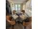 Dining room with round glass table, seating four, and bright natural light at 300 N 22Nd St, Bradenton Beach, FL 34217