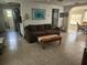 Inviting living room with neutral walls, a brown sofa, and an open archway to the dining area at 300 N 22Nd St, Bradenton Beach, FL 34217