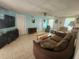 Cozy living room with tiled floors, a ceiling fan, and natural light from windows at 300 N 22Nd St, Bradenton Beach, FL 34217