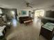 Comfortable living room featuring tile floors, and seamless access to the dining and kitchen areas at 300 N 22Nd St, Bradenton Beach, FL 34217