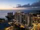 Night aerial of luxurious residential building with stunning ocean views and resort-style amenities at 301 Quay Commons # 1709, Sarasota, FL 34236