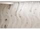 Detailed view of unique, wavy-patterned kitchen backsplash at 301 Quay Commons # 1709, Sarasota, FL 34236