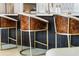 Close-up of kitchen island bar stools with wood backs and gold frames at 301 Quay Commons # 1709, Sarasota, FL 34236