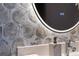Close-up of modern bathroom tile and fixtures at 301 Quay Commons # 1709, Sarasota, FL 34236