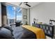 Bright bedroom with city views, featuring a modern desk, sleek furniture, and stylish decor at 301 Quay Commons # 1709, Sarasota, FL 34236