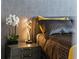 Bedroom detail showcasing a modern lamp, decorative flowers, and stylish nightstand at 301 Quay Commons # 1709, Sarasota, FL 34236