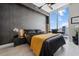 Modern bedroom featuring a chic design, city views, and a cozy workspace by the window at 301 Quay Commons # 1709, Sarasota, FL 34236