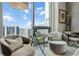 Cozy bedroom sitting area with city and ocean views and telescope for stargazing at 301 Quay Commons # 1709, Sarasota, FL 34236