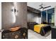 Luxurious bedroom with a stunning black and gold color scheme, modern lighting, and city views at 301 Quay Commons # 1709, Sarasota, FL 34236