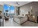 Bright bedroom with a view features a large window, neutral tones, and luxury finishes at 301 Quay Commons # 1709, Sarasota, FL 34236