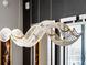 Close-up of a modern, sculptural chandelier with crystal accents at 301 Quay Commons # 1709, Sarasota, FL 34236