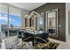 Elegant dining area with designer lighting and city views at 301 Quay Commons # 1709, Sarasota, FL 34236