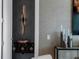 Stylish entryway with modern lighting, decorative console table, and wallpaper at 301 Quay Commons # 1709, Sarasota, FL 34236