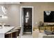 Elegant entryway featuring modern lighting, decorative console table, and stylish decor at 301 Quay Commons # 1709, Sarasota, FL 34236