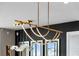 Modern lighting fixture with unique design over dining and kitchen area at 301 Quay Commons # 1709, Sarasota, FL 34236