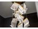Modern lighting fixture features translucent rectangles trimmed in gold at 301 Quay Commons # 1709, Sarasota, FL 34236
