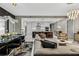 Open-concept living area with modern kitchen, dining space, and comfortable seating at 301 Quay Commons # 1709, Sarasota, FL 34236