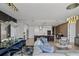 Open-concept living area with modern kitchen, dining space, and comfortable seating at 301 Quay Commons # 1709, Sarasota, FL 34236