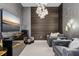 Modern living room features unique wall textures, stylish lighting, and comfortable seating at 301 Quay Commons # 1709, Sarasota, FL 34236