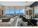 Spacious living room with balcony access and city views at 301 Quay Commons # 1709, Sarasota, FL 34236
