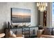 Living room with console table, artwork and flat screen TV at 301 Quay Commons # 1709, Sarasota, FL 34236