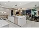 Open-concept kitchen and living area with modern furnishings and city views at night at 301 Quay Commons # 1709, Sarasota, FL 34236