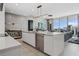 Open-concept kitchen and living area with modern furnishings and city views at 301 Quay Commons # 1709, Sarasota, FL 34236